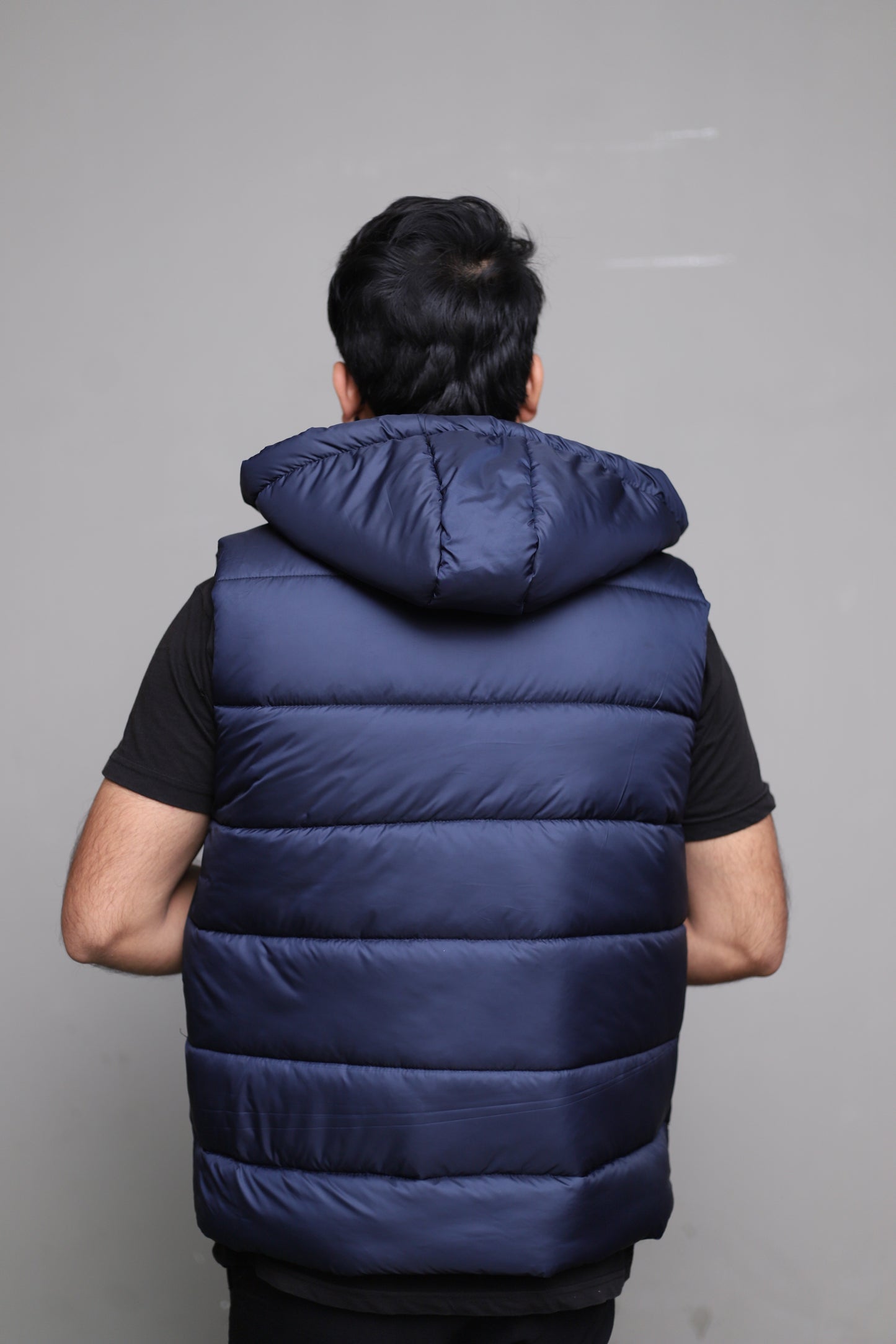 Imported blue sleeveless puffer jacket